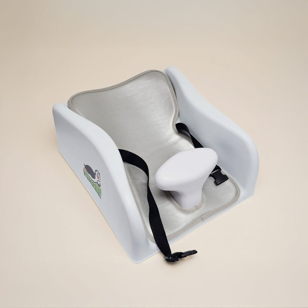 Tumzee tummy time incline tool, a moulded support that holds a baby at a 15-degree angle