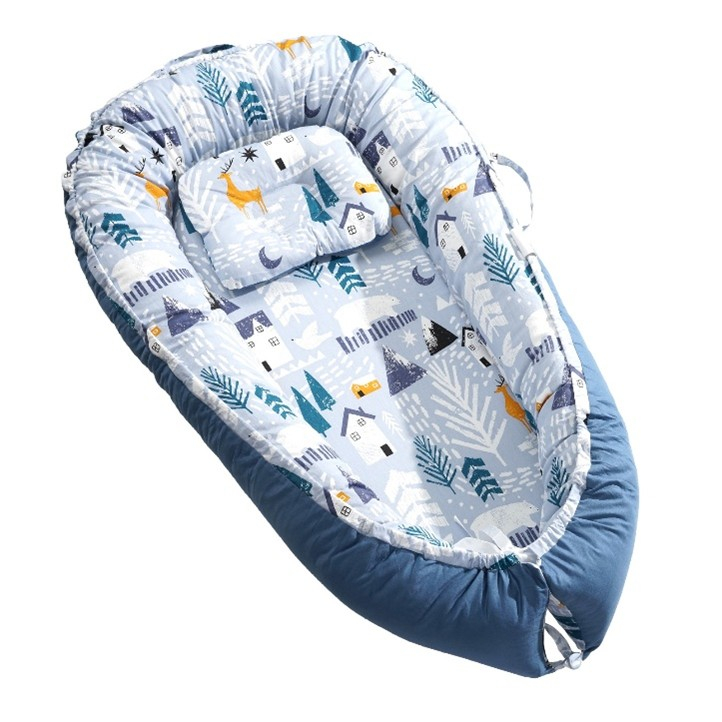 A baby lounger of the type repeatedly recalled: a foam sleeping pad ringed by soft padded bumpers with low sides and an open foot end